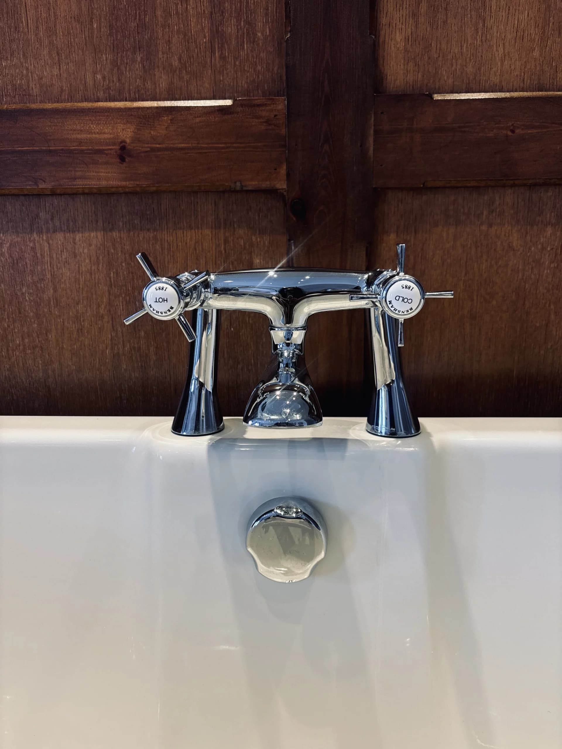 Vintage chrome bath taps on a white freestanding bath